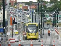 Tram 3071 and 3070 Stand at the new Mumps stop on test with  Huddersfield Rd behind on Wednesday 21/08/2013. Photo R. Clarke 